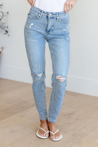 Mid rise control top distressed skinny jeans