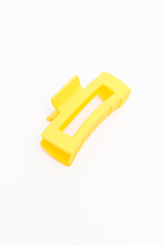 white background yellow claw clip